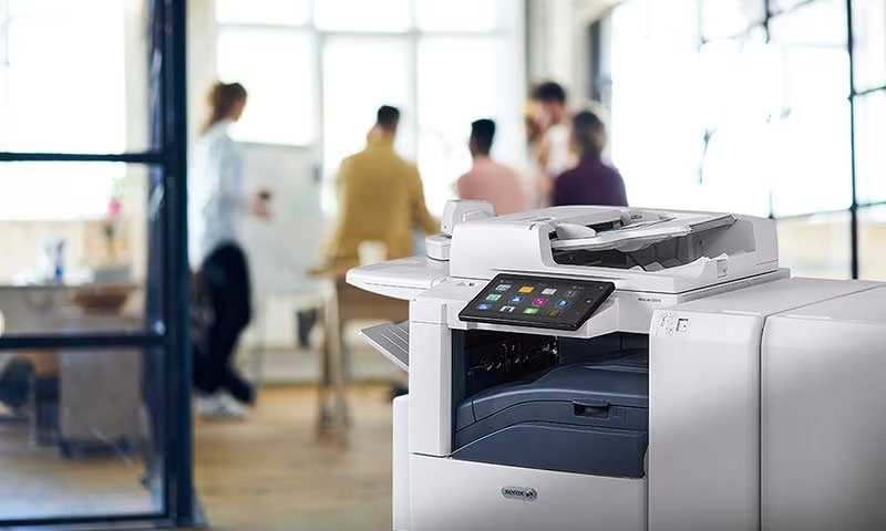 Xerox® AltaLink multifunction printer in an office Xerox® AltaLink multifunction printer in an office