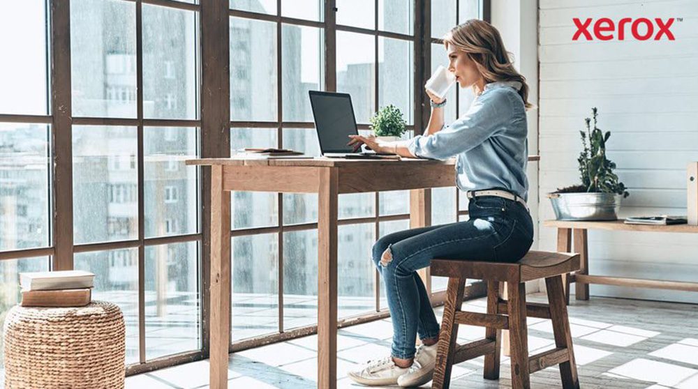A woman at a desk, utilizing a laptop, demonstrating concentration and productivity. A woman at a desk, utilizing a laptop, demonstrating concentration and productivity.