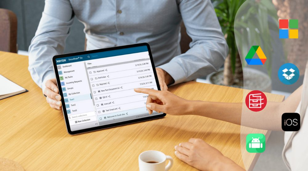 A hand holding a tablet is interacting with a Xerox multifunction printer's touchscreen, displaying various icons including mobile and cloud storage logos, symbolizing broad compatibility and seamless integration with Xerox DocuShare Go.